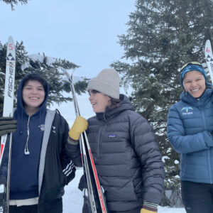 Three women skiing