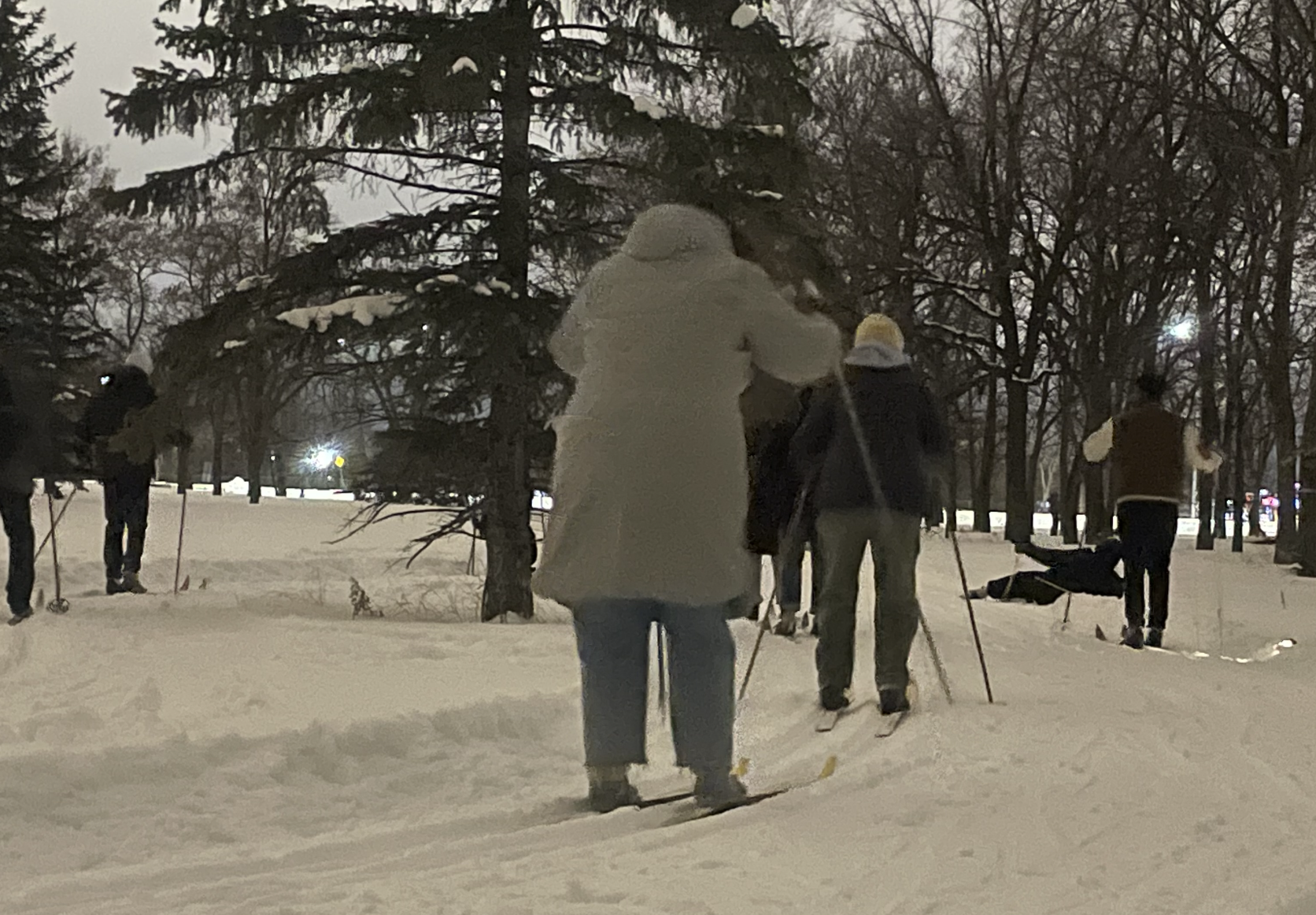 women skiing at night