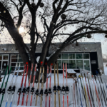 skiis in a line in front of kilter brewery