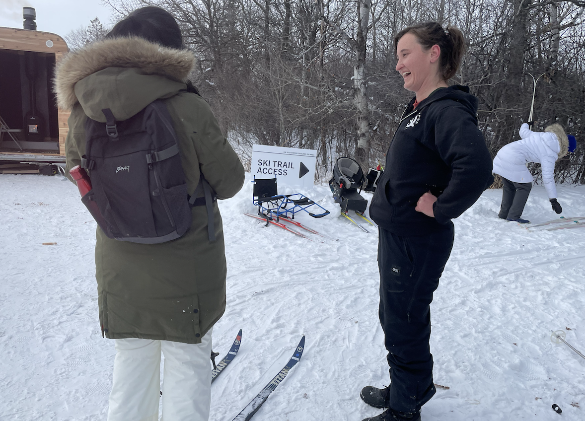 staff laughing women skiing