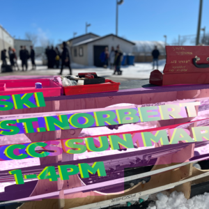 picture of skis stored horitzontal with the words Ski St Norbert Mar 2in an 80s glitchy futurist style